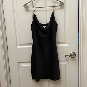 Black silk mini dress with diamond rhinestone straps and cowled neck.